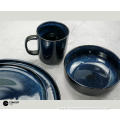 Reactive glazed stoneware dinner set in Dark blue